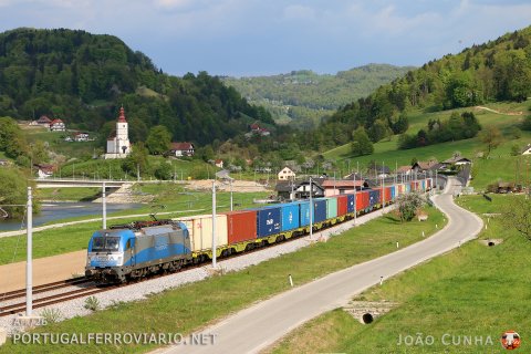 With the river Savinja behind, 1216.921 passes by Marija Gradec with a beautiful consist heading to Koper