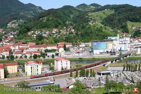 A short, beautiful coal train from Koper to Austria is seen passing in the middle of the beautiful city of Lasko